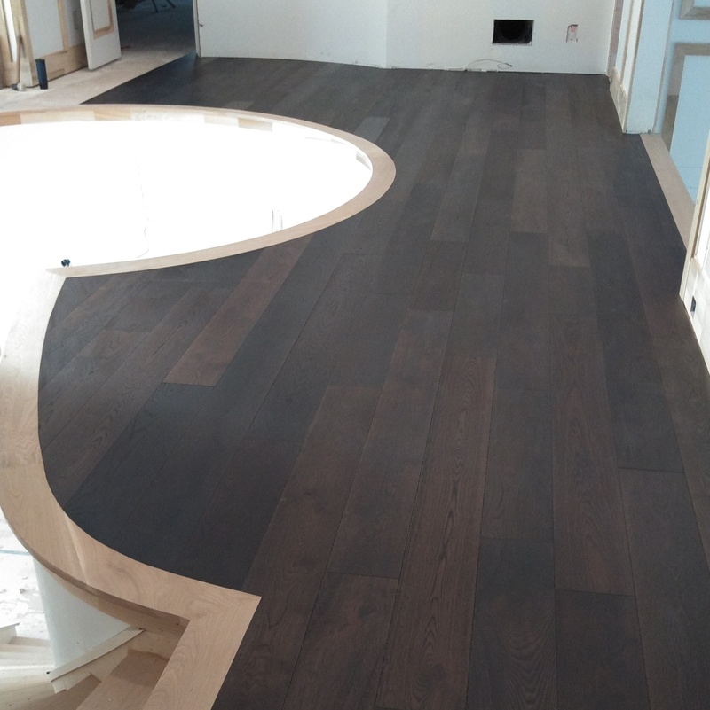 Prefinished Engineered flooring cut to existing curved nosing pieces.